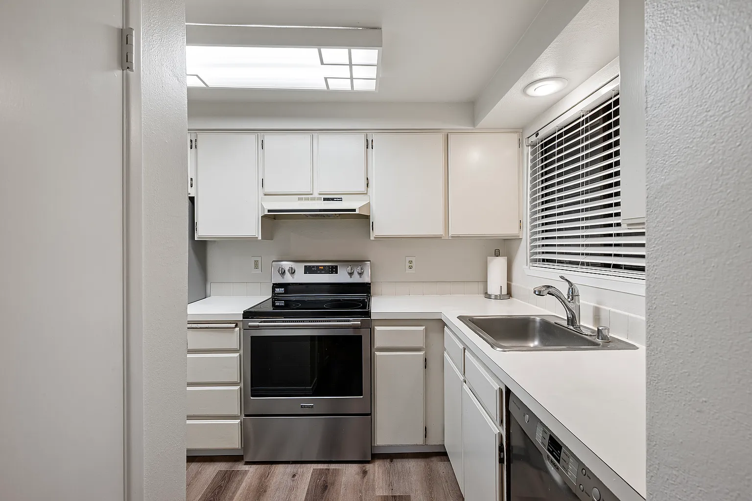 Rare corner condo offering privacy, natural light, and peaceful territorial views