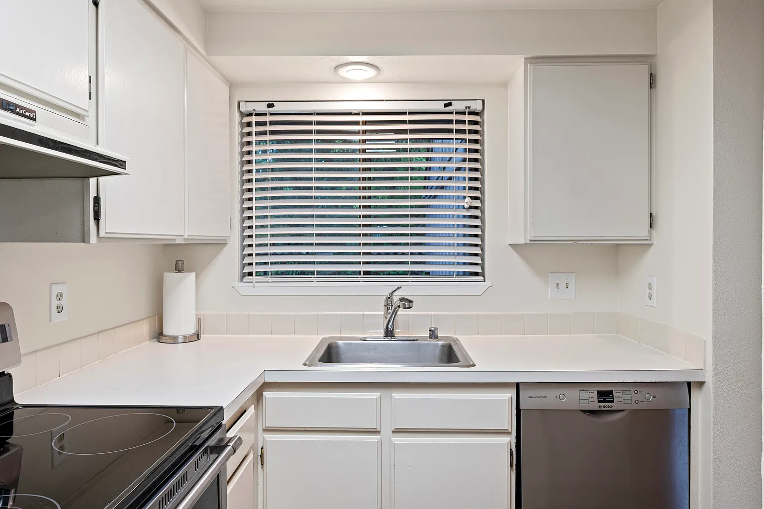 Rare corner condo offering privacy, natural light, and peaceful territorial views