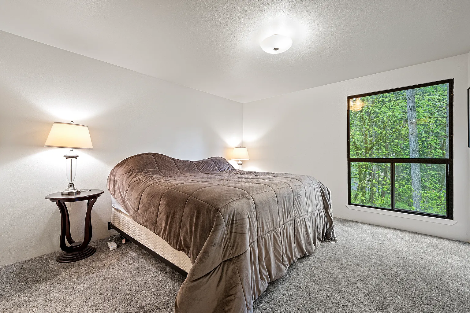 Rare corner condo offering privacy, natural light, and peaceful territorial views