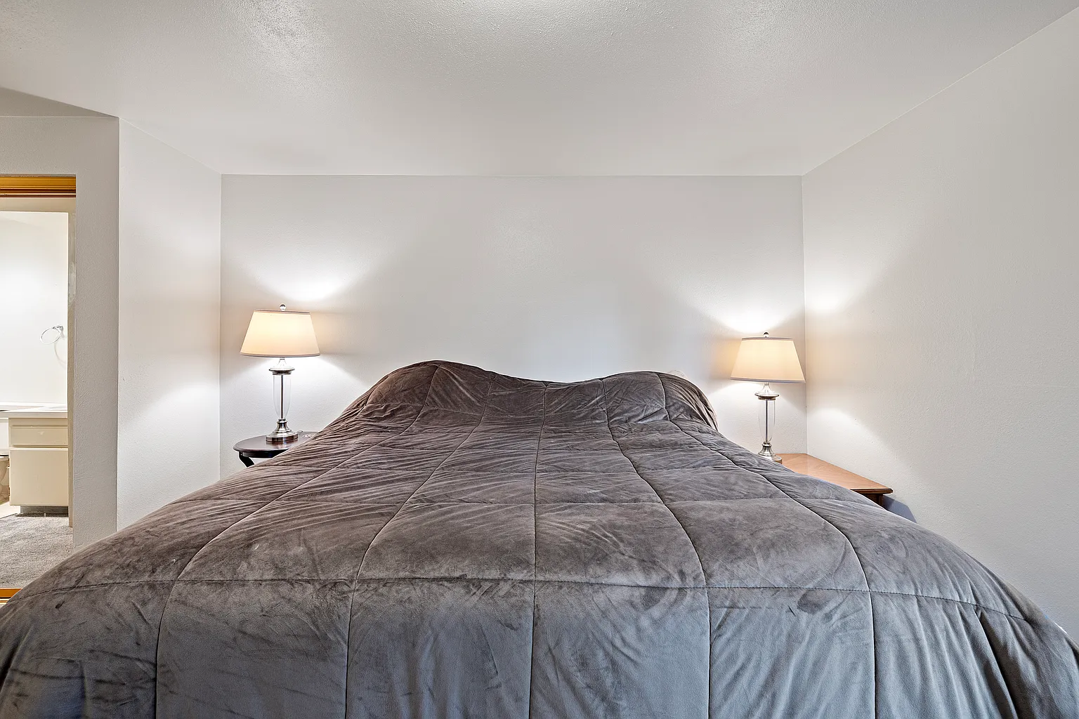 Rare corner condo offering privacy, natural light, and peaceful territorial views